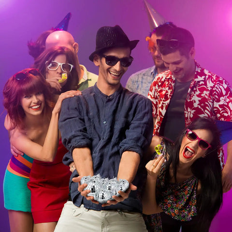 Group of people holding 30 Pcs Mini Disco Ball Ornaments Hanging Mirror Balls For Party Decor Wedding at a festive event.