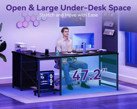 Man seated at an L Shaped Gaming Desk With Four Drawers And Power Outlets For Home Office 61 Inch Corner Desk With USB Charging Port And Host Stand Dual Monitor Ready Reversible Layout Easy To Assemble Black, showing spacious under-desk area.