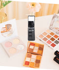 Dope New Compact Travel Makeup Palette With Mirror, Four Pack Empty Eyeshadow Containers For Portable Cosmetic Refills And Fly On The Go Beauty Organizers on a table.