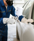 Heavy Duty Lvlp Air Spray Gun Featuring Gravity Feed Cup And Quick Swap Nozzles For A Hella Smooth Automotive And Wood Finish Includes Built In Pressure Regulator For No Fuss Shop Work used for painting a car door.