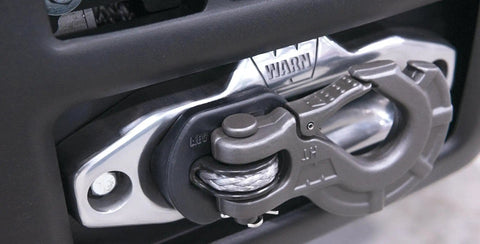 Close-up of AEV Winch Hook Isolator Fairlead Protector Hook Stopper for off-road winching, durable polyurethane, attached to 4WD vehicle.