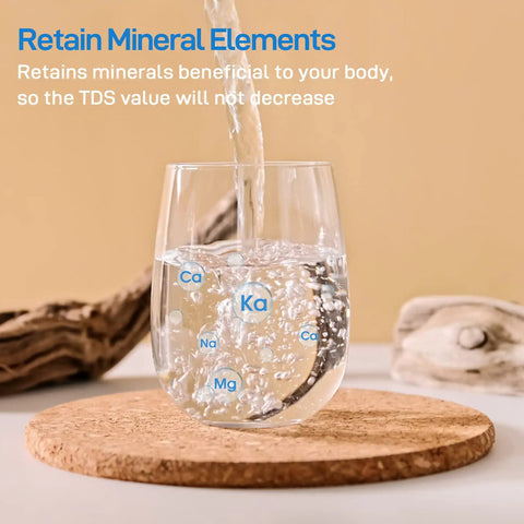 Water being poured into a clear glass labeled with minerals, showcasing features of the Replacement Filter For OM-CF01 Countertop Water Filter System, Lasts Up To 9 Months, 1 Pack, No Fuss Snap-In Install, Keeps Water Tasting Fresh And Clean, Easy Kitchen Upgrade You Can Trust.