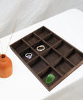 Vintage Solid Wood Jewelry Tray With 12 Spacious Compartments Smooth Edge Ring Holder, displaying rings on a flat surface.