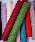 Colorful rolls of Pro Grade Flower Wrapping Mesh Paper For Bouquets, Irregular Hollow Net Wrapper, 50Cm Wide Roll, 4.5M Long displayed.