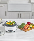 Rice Cooker With 6 Cup Cooked Capacity, No Fuss Steaming Basket And Removable Nonstick Bowl, Auto Keep Warm on kitchen counter with vegetables