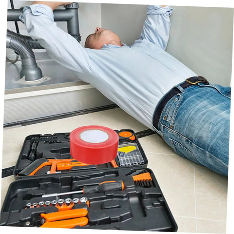 Man using Heavy Duty Outdoor Seam Tape For Plumbing Leaks And Weatherproofing Sealant Duct Tape Repair Tape Leak Stop Tape in kitchen
