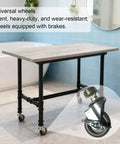 Heavy Duty Table Legs With 360 Degree Swivel Casters For Office Furniture Stand Featuring Lock In Place Brakes on a workshop table.