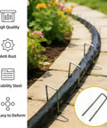 All In One Garden Stake Staples Kit With 100 6 Inch U Shaped Staples 100 Fixing Washers Rubber Mallet Pick Hook And Carry Bag For Weed Barrier Fabric Ground Cover Fence Posts And Artificial Turf displayed in garden