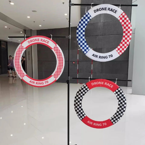 Outdoor Drone Obstacle Course Kit For FPV Racing Indoor Quadcopter Gates in red and blue checkered patterns in a hallway
