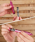 Pretty Dang Useful 24 Piece Mini Screwdriver Set With Slick Magnetic Bits And Precision Driver Options In Pink, showing hands holding the driver.