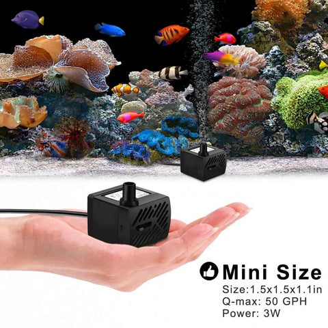 Hand holding Ultra Quiet 50 GPH 3W Mini Submersible Water Pump in front of aquarium setup, highlighting compact size.