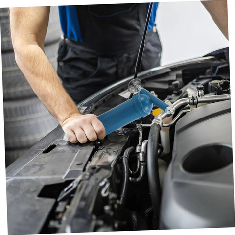 Mechanic using Mini Grease Gun 80cc With Locking Nozzle Manual Lubrication Tool under car hood