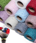 Pro Grade Flower Wrapping Mesh Paper For Bouquets in various colors, stacked rolls with irregular hollow net pattern
