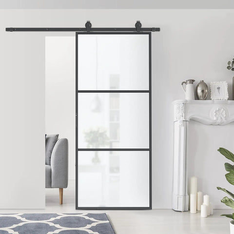 Super Slick Frosted Privacy Glass Barn Door Hardware Kit With Heavy Duty Track And Silent Rolling Wheels For Easy 36 By 84 Inch Sliding Install Plus Smooth Gliding Action Room Divider Setup displayed in a modern living space.