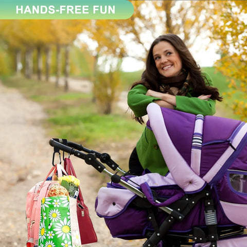 Woman smiling with stroller and Go To Hands Free Stroller Hooks For Bags, 2 Pack Non Slip Clips holding bags on a walk