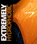 Close-up of water beading on a car hood, text reading 'Extremely Hydrophobic'. Feature of Platinum Rapid Ceramic Paint Sealant Spray 14 Oz With 50 Wash Rating For Boss Gloss And Shine, Sick Hydrophobic Beading And Slickness, Long Lasting Ceramic Coating For Showroom Shine.