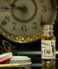 Pro Grade Clock Oil Kit For Cleaning And Lubing Movements, glass bottle of clock oil with clock parts and vintage clock face