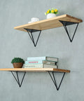 Rock Solid Heavy Duty Shelf Brackets In Matte Black Cast Iron Triangle Wall Mount Supports With Full Hardware Kit Easy Diy Floating Shelves mounted with wood and books.