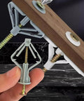 Heavy Duty Gypsum Board Expansion Screws With Nylon Butterfly Anchors held in hand, showcasing secure grip design for mounting.