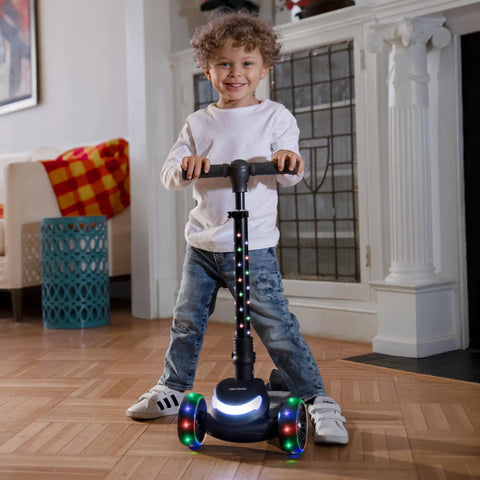 Three Wheel Light Up Kick Scooter For Kids Super Stable Design With Adjustable Handlebar LED Lights On Stem And Wheels No Tool Foldable Design Rear Foot Brake Beginner Friendly Red, child riding indoors