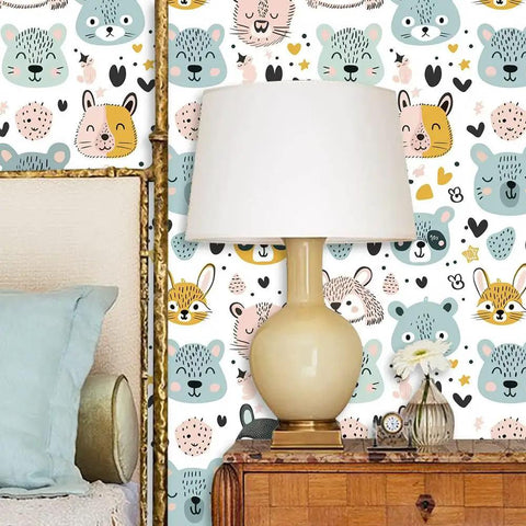 Slick Pastel Woodland Peel And Stick Wallpaper With Cute Animal Head Prints in a cozy bedroom setting with lamp and decor.