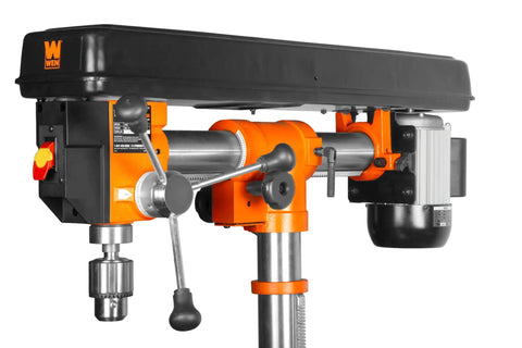 Side view of Six Point Two Amp Thirty Three Inch Radial Arm Drill Press for benchtop use with cast iron construction and five speeds.