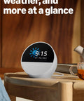 Dope Wireless Smart Alarm Clock With Sleek Build And Thumping Bass Solid For Nightstands Or Kitchens Checks Weather Streams Tracks Manages Connected Devices Glossy Black on wooden table displaying time and weather.