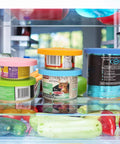 Universal Silicone Can Lids For Dog And Cat Food, 3 Pack With Spoon, Multi Colored Set on cans in fridge