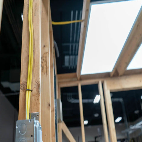 SIMpull 25 ft 12/2 NM-B copper building wire installed on indoor wooden framing