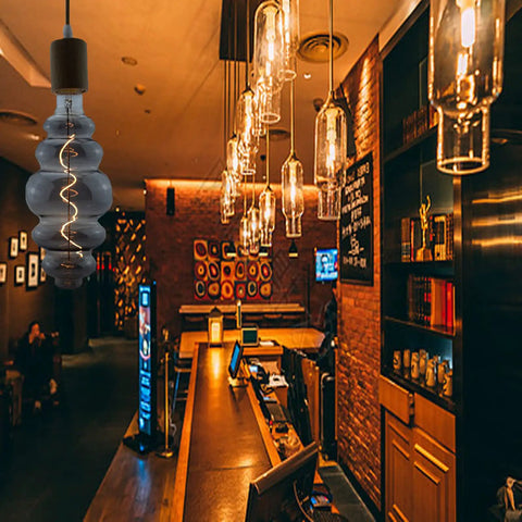 Beehive Style 4W Dimmable LED Edison Bulb With Oversized Spiral Filament in a vintage bar setting