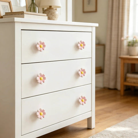 White dresser with 6 Pieces Ceramic Daisy Drawer Knobs Set For Nursery And Kids Room Cute Cabinet Pulls For Dressers And Furniture.