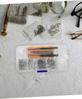 Eyeglass Repair Kit With Screws Screwdriver Tweezers Sunglasses Nose Pads Ear Hooks And Cleaning Cloth For Quick No Fuss Glasses Fixes Durable Diy Tool Set For Beginners To Pros on table