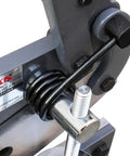 Close-up of a heavy duty metal shear mechanism with steel components, ideal for cutting sheet metal in repairs and fabrication projects.