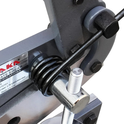 Close-up of a heavy duty metal shear mechanism with steel components, ideal for cutting sheet metal in repairs and fabrication projects.