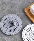 Top Shelf Silicone Hair Catcher For Bathtubs And Showers Blocks Debris With Ease, flexible round drain guards in gray and white.