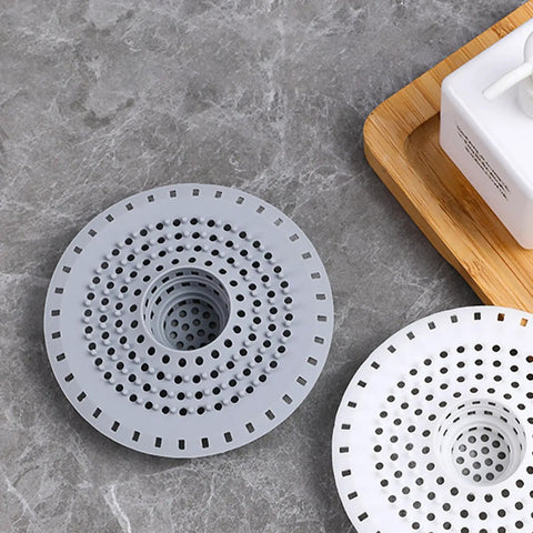 Top Shelf Silicone Hair Catcher For Bathtubs And Showers Blocks Debris With Ease, flexible round drain guards in gray and white.