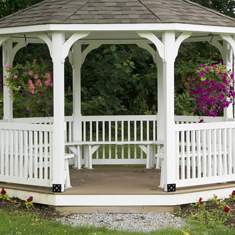 White gazebo with hanging flowers showing Beefy 4 Pack U Shape Post Anchors For Concrete 6x6 Post Base installed on corners.