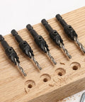 Five Piece Hex Shank Countersink Drill Bit Kit With Quick Release Crank Handle For Dead Simple Woodworking Hole Prep No Brainer Setup Fast Drilling And Solid Steel Construction That Definitely Gets The Job Done on wood.