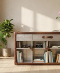 Sharp Aviator Bookcase Featuring Hand Beaten Aluminum Build And Single Storage Drawer Heavy Duty Industrial Home Office Shelves 60 Inches Tall For A Killer Workspace Vibe in living space with plants.