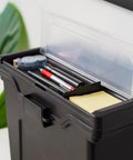 Lockable File Box With Lid For Letter Files Portable Document Organizer With Hanging File Ledge Water Resistant Handy Carry Handle Secure Buckle Black showing organized storage with lid open and a plant in the background
