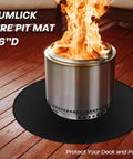 36 Inch Round Fire Pit Mat For Solo Stove Bonfire And Ranger 2.0 under a lit fire pit on wooden deck
