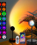 Sunset Lamp Projector With RGB LED Lights, 360 Rotating Mood Light For Bedroom, App And Remote Control next to remote and phone