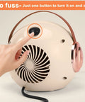 Back view of Compact Desk Heater For Office And Home Personal 500W PTC Ceramic Space Heater with a finger pressing the power button.
