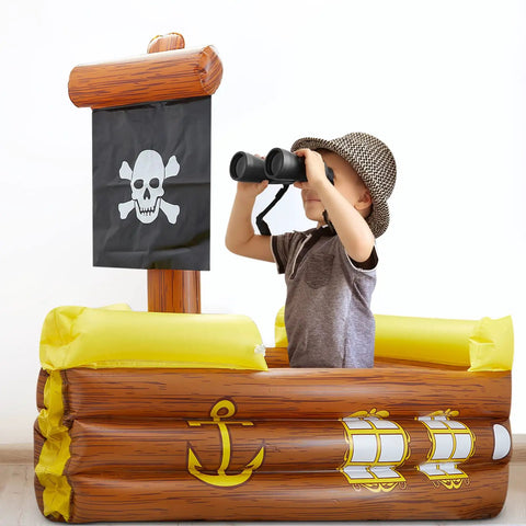 Child playing in an Inflatable Pirate Ship Cooler For Pool Parties And Gasparilla Decor, with binoculars onboard.