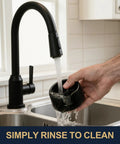 Portafilter Holder With Tamper Base For Luxe Cafe Pro ES601 ES701 being rinsed under a kitchen faucet