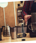 Game Changer 3 Piece Espresso Coffee Powder Stirrer Set Heavy Duty Stainless Steel Wands on a coffee bar countertop.