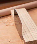 Top Shelf Six Piece Cabinet Scraper And Burnisher Kit With Blue Spring Steel Blades Plus Hardened High Speed Steel Sharpening Rod For Knockout Woodworking Finishes Daily showing a blue spring steel blade on wood.