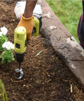 Person using No Sweat Easy Garden Auger Drill Bit For Fast Hole Digging In Soil 4cm By 22cm Fits Standard Power Drills Great For Bulbs Seedlings