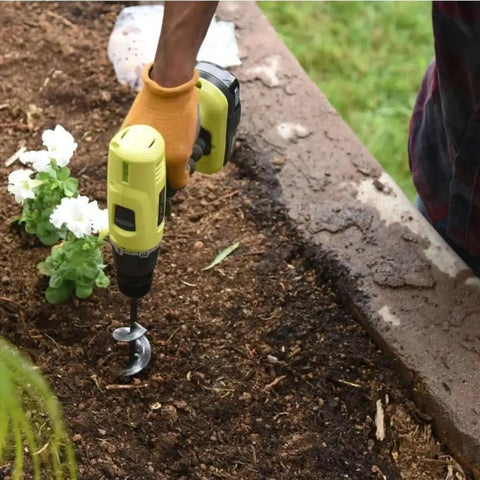 Person using No Sweat Easy Garden Auger Drill Bit For Fast Hole Digging In Soil 4cm By 22cm Fits Standard Power Drills Great For Bulbs Seedlings