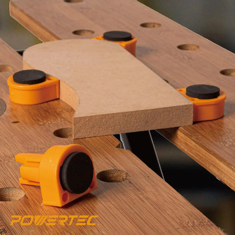 Rock Solid Workbench Clamp Set For Woodworking Holds Your Boards Tight Includes Two 8 Inch Hold Fast and four orange deluxe bench dogs.